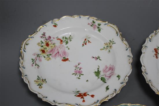 A Chelsea gold anchor bird and insect plate and a similar pair of floral plates, c. 1765, 22 and 23cm